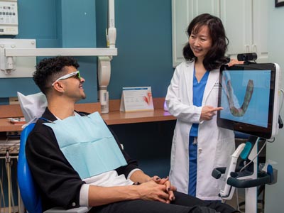 Dr. Grace Lee discussing cosmetic dentistry options with a patient