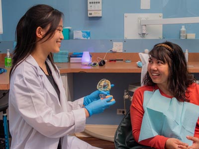 Dr. Shin discussing dental crown options at Elite Dental