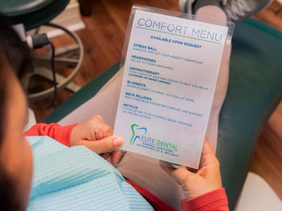 patient reviewing Elite Dental's comfort menu
