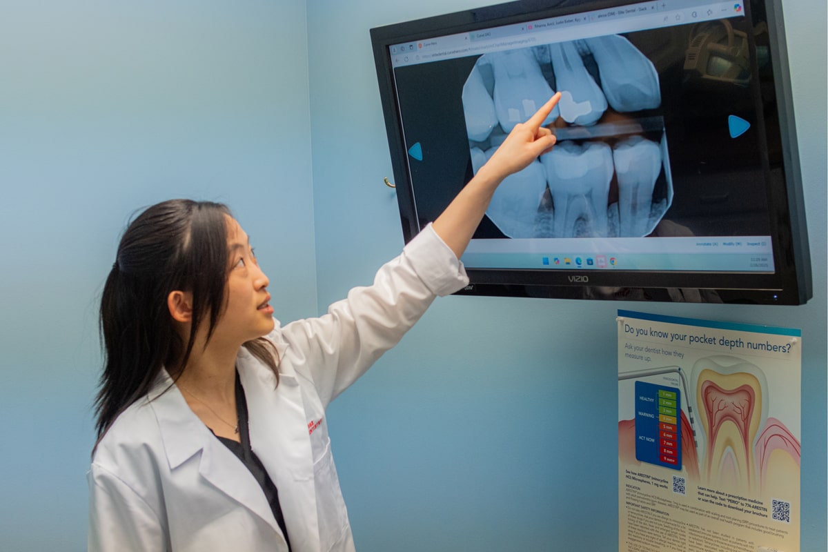 patient's X-rays being reviewed at Elite Dental